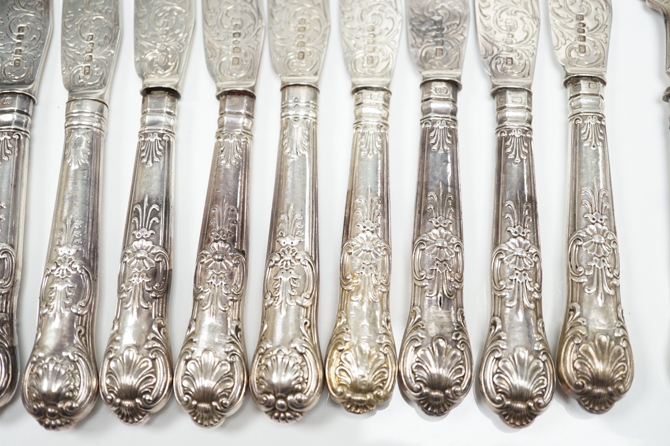 A set of ten pairs of Victorian silver Queen's pattern dessert eaters, maker, JG, Birmingham, 1856/7, loaded handles.